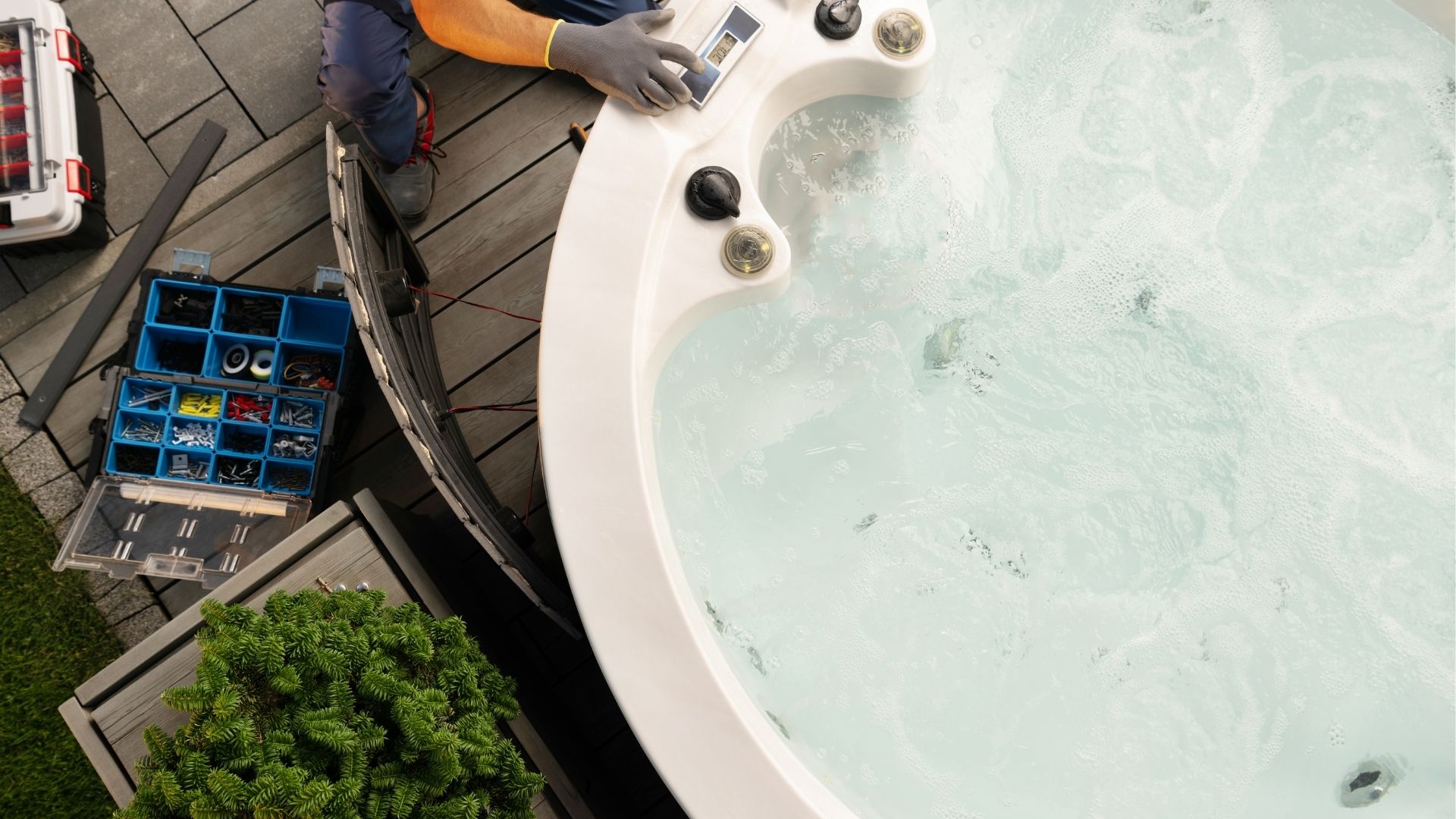 Hot tub repair man working on a round hot tub